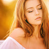 Brightening Acids Below the Neck: How to Safely Use Kojic, Mandelic and Lactic on Body Skin